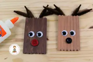 Learn how to make cute DIY Reindeer ornaments from craft sticks! These are easy enough for kids to make. They look great on the tree, and make perfect kid-made gifts. 